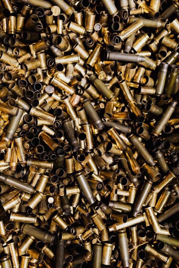 A high-angle view of numerous empty brass bullet casings.